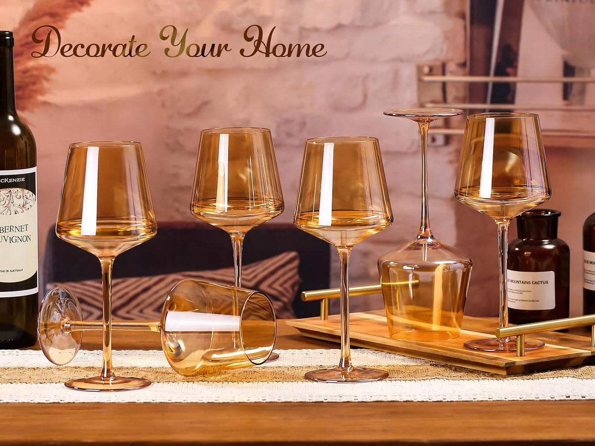 Amber wine glasses arranged on a wooden table