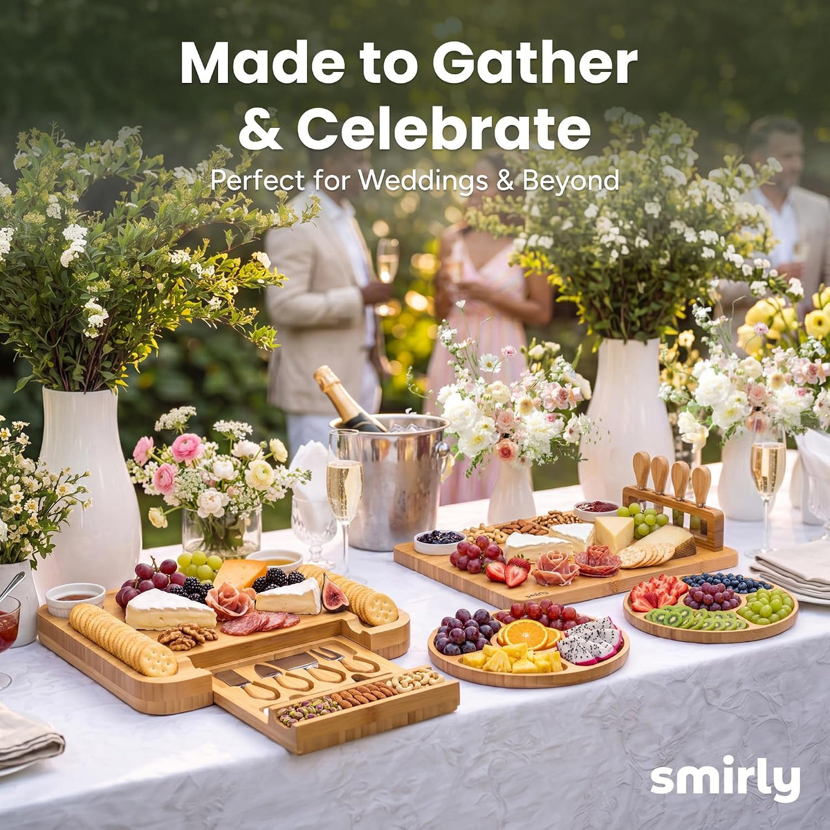 SMIRLY charcuterie boards on a celebration table with flowers and champagne