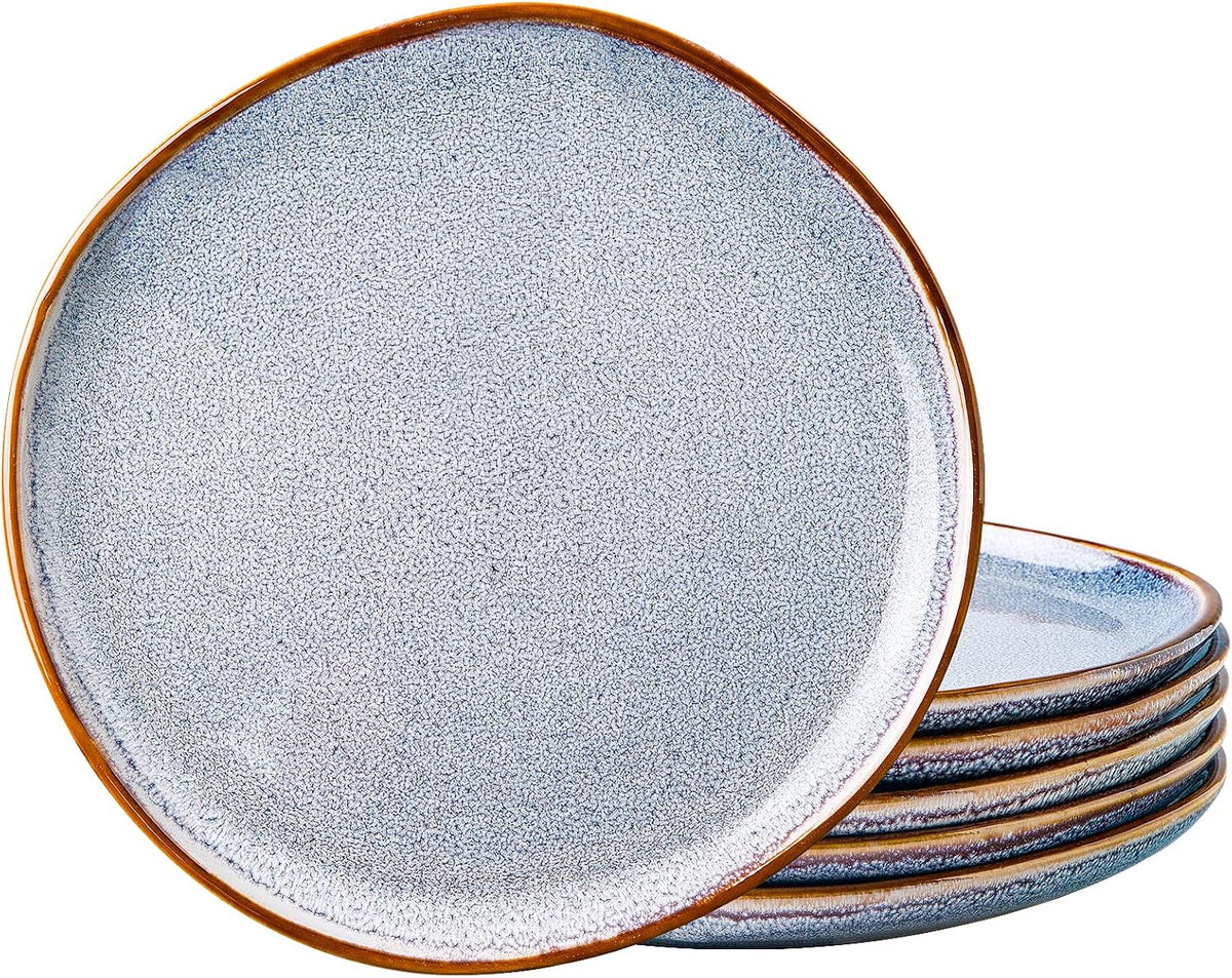 Six blue reactive-glaze stoneware dinner plates with a brown rim