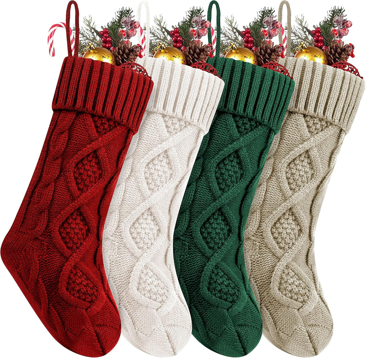 Four cable knit Christmas stockings in burgundy, ivory, green and khaki