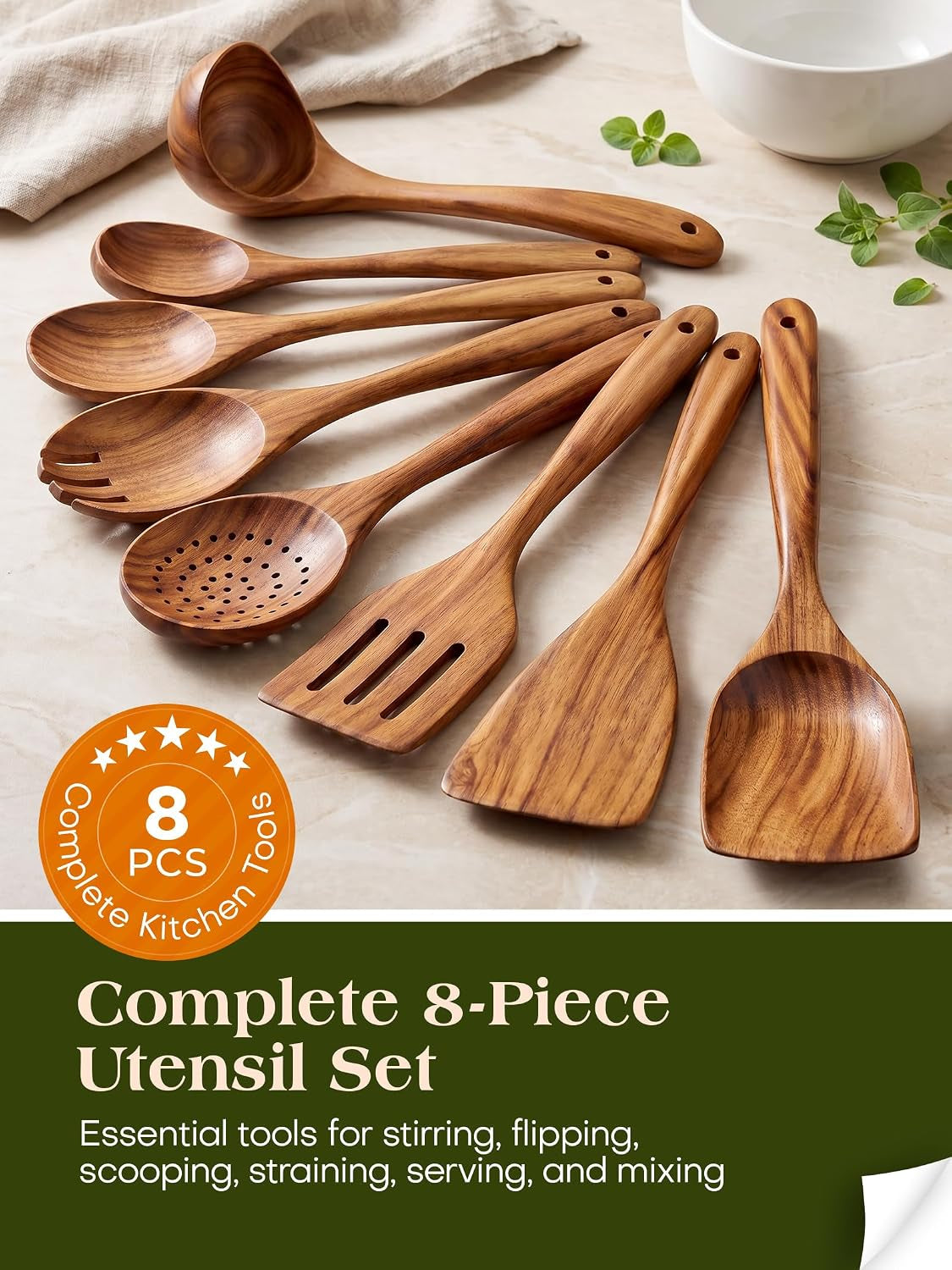 The complete 8-piece teak utensil set on a kitchen counter