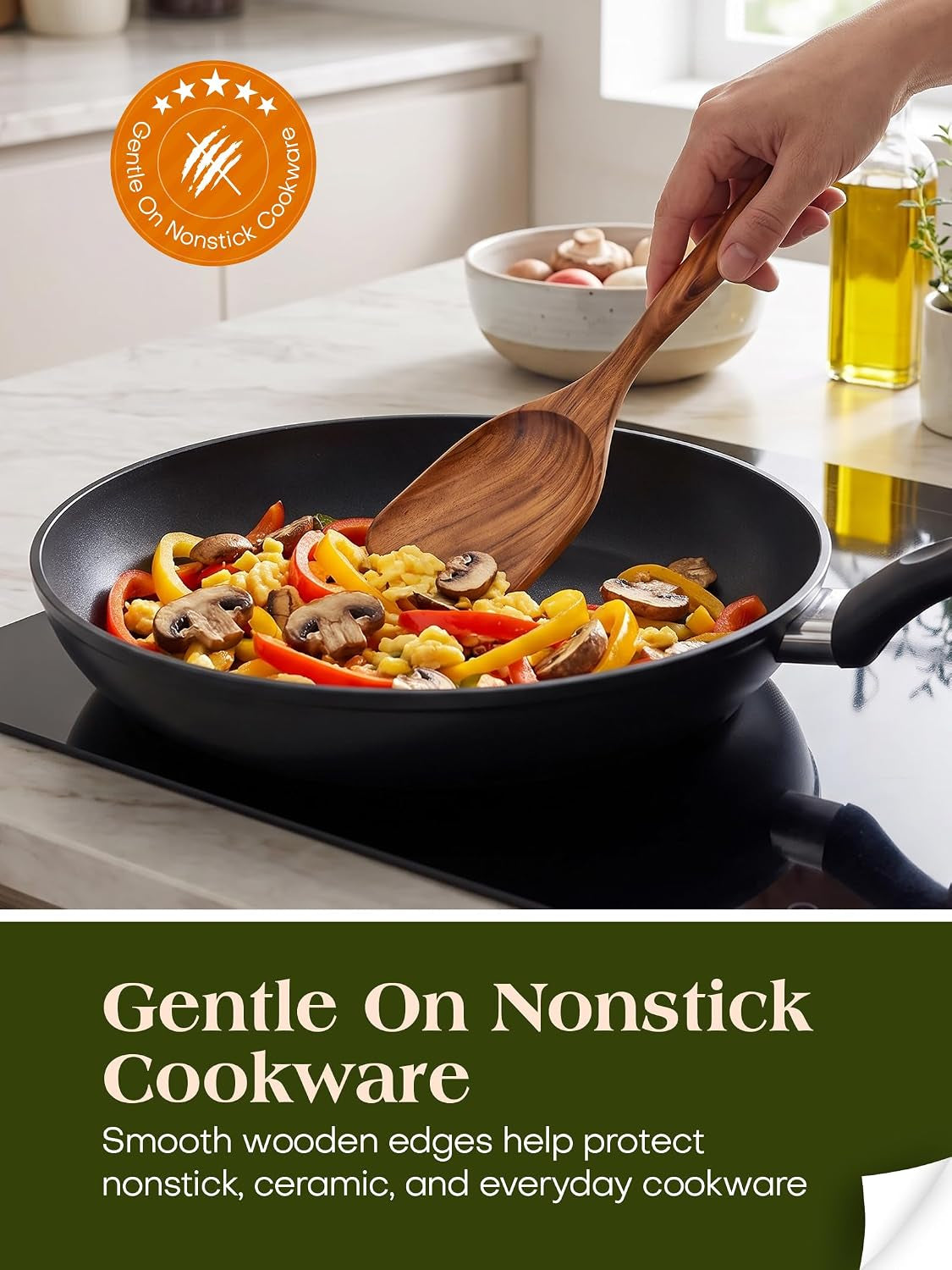 Teak spatula stirring vegetables in a nonstick pan