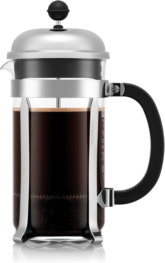 Bodum Chambord French press with a polished frame and black handle, filled with coffee