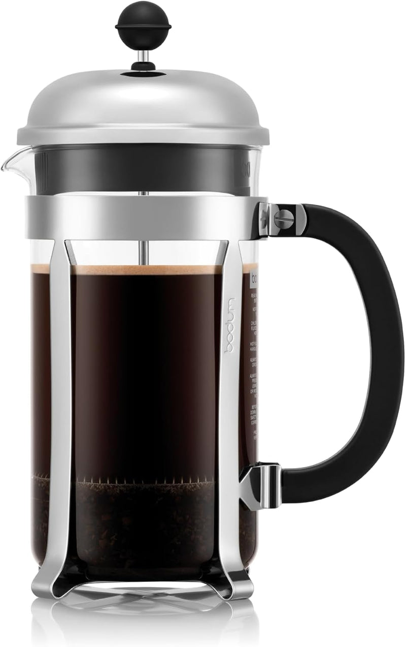 Bodum Chambord French press with a polished frame and black handle, filled with coffee