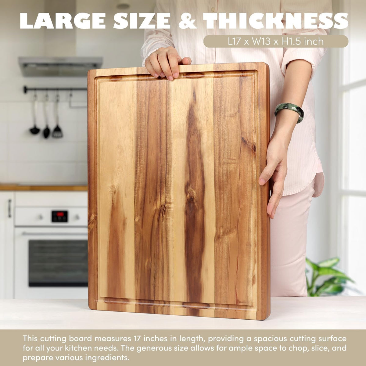Person holding the 17 x 13 inch acacia board upright in a kitchen