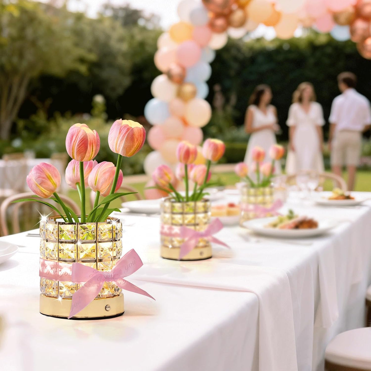 Tulip table lamps as centerpieces on an outdoor party table