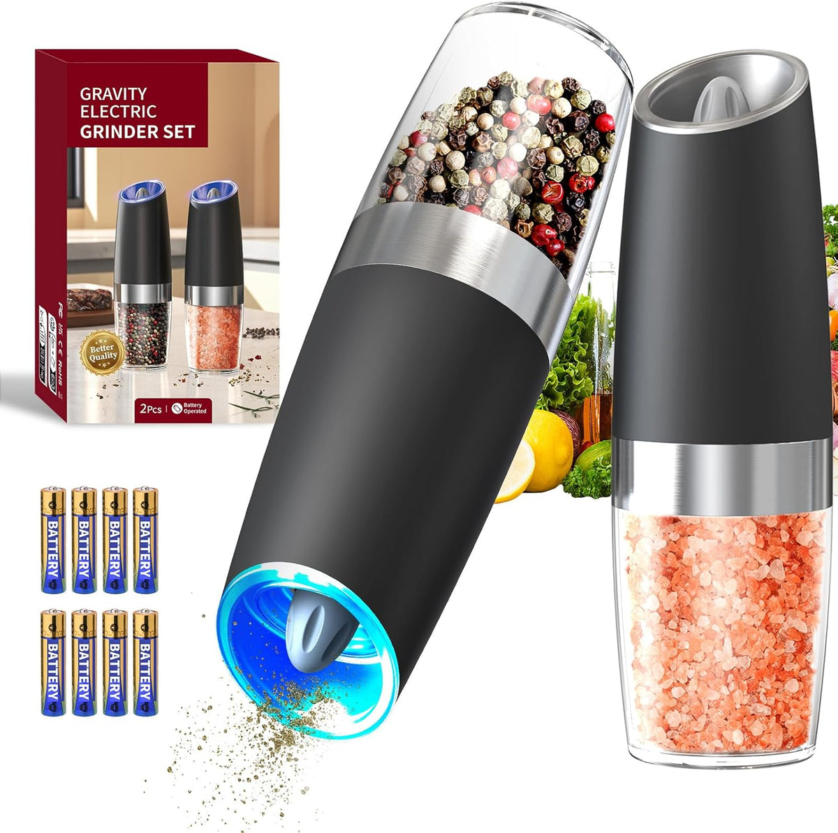 Black gravity electric salt and pepper grinders, one tipped and grinding with its blue light on