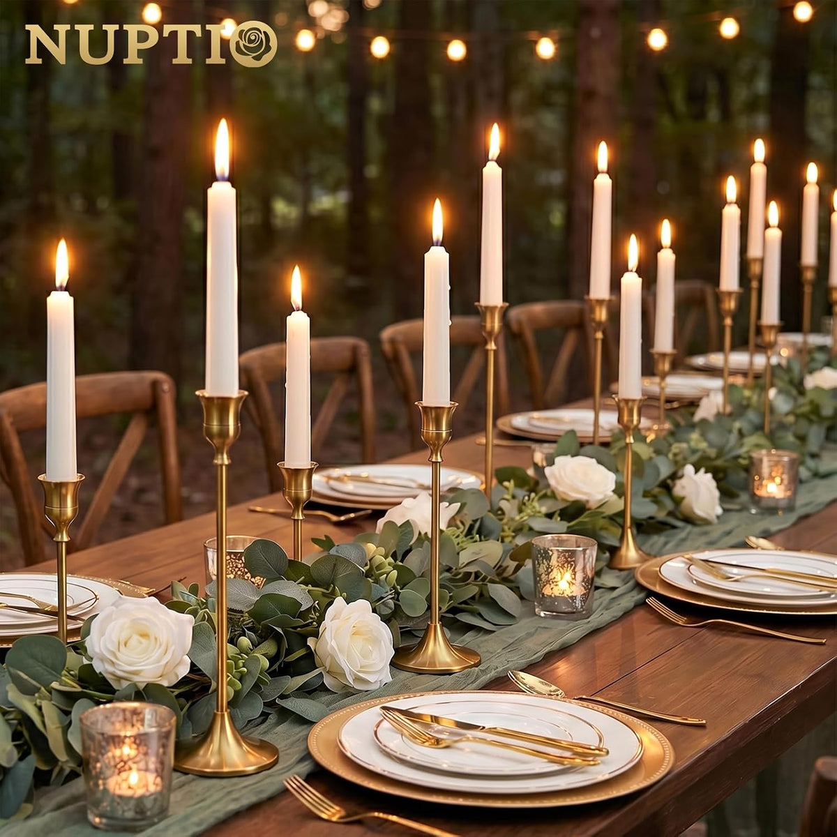 Gold candle holders down the center of a set dinner table
