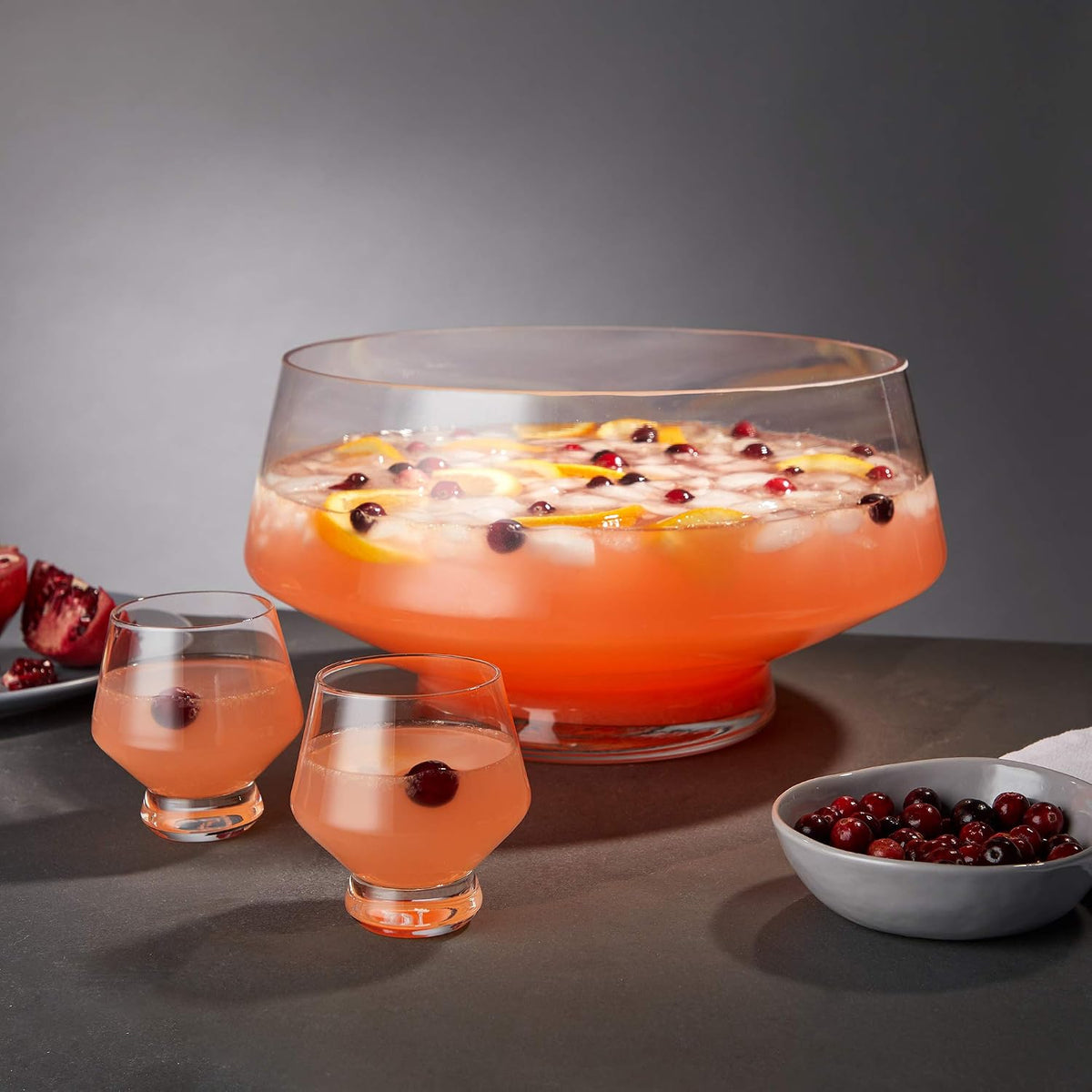 Viski Raye punch cups beside the matching footed punch bowl