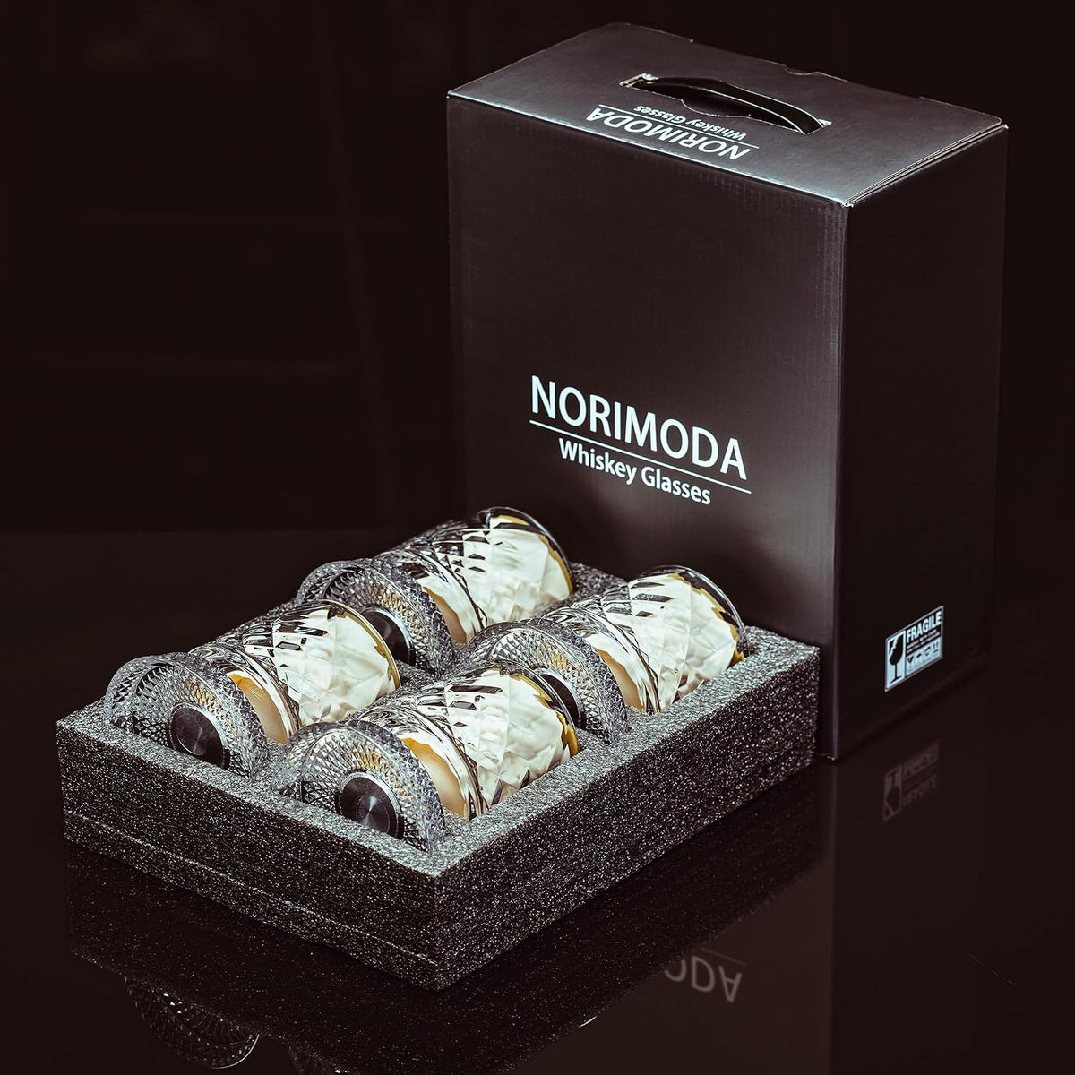 Whiskey glasses packed in foam inside the NORIMODA gift box