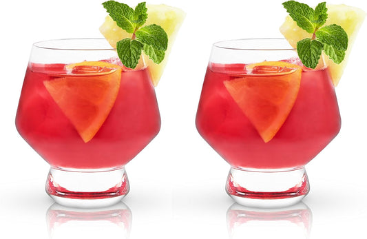 Two Viski Raye footed punch cups filled with red punch and mint