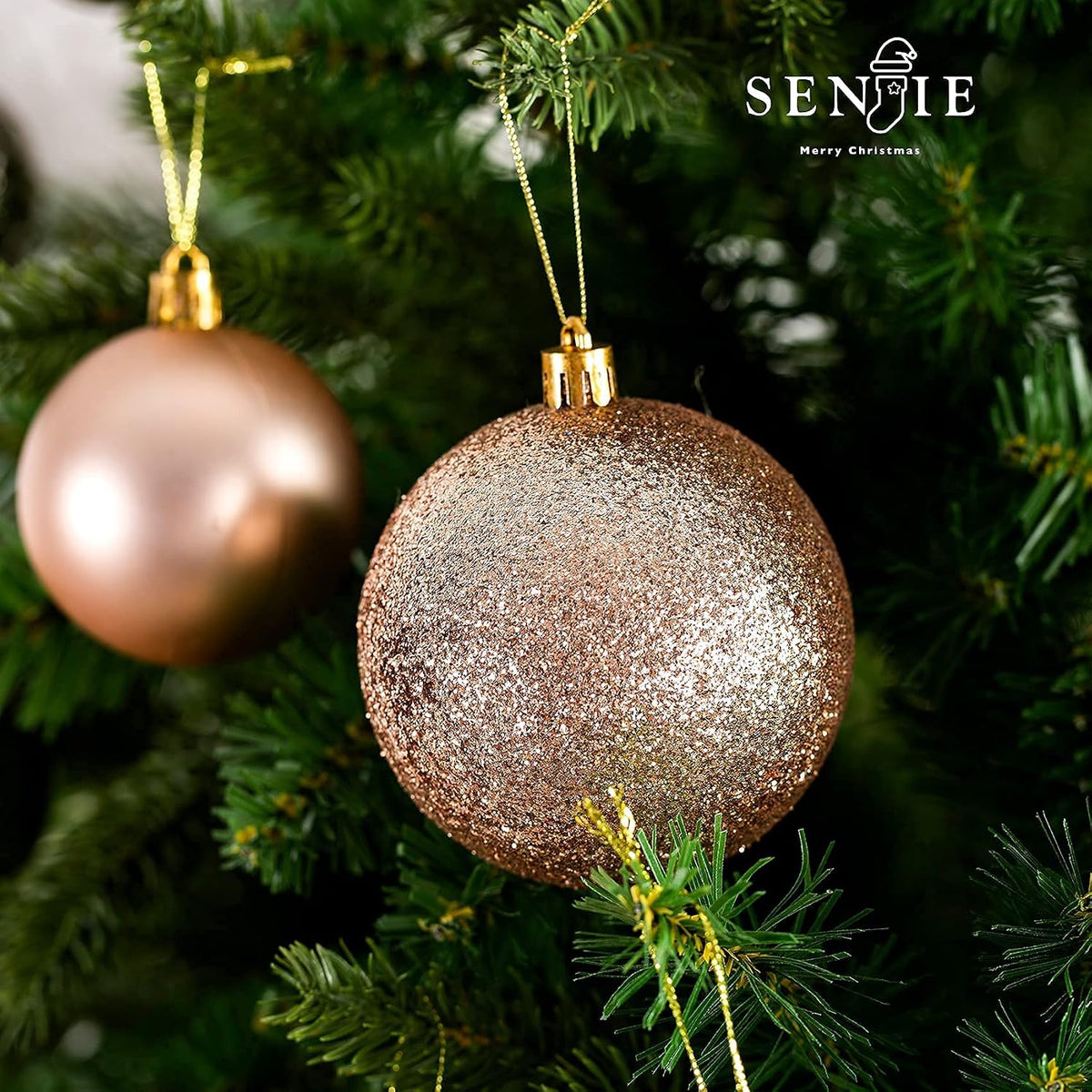 Matte and glitter champagne ornaments hanging on a tree