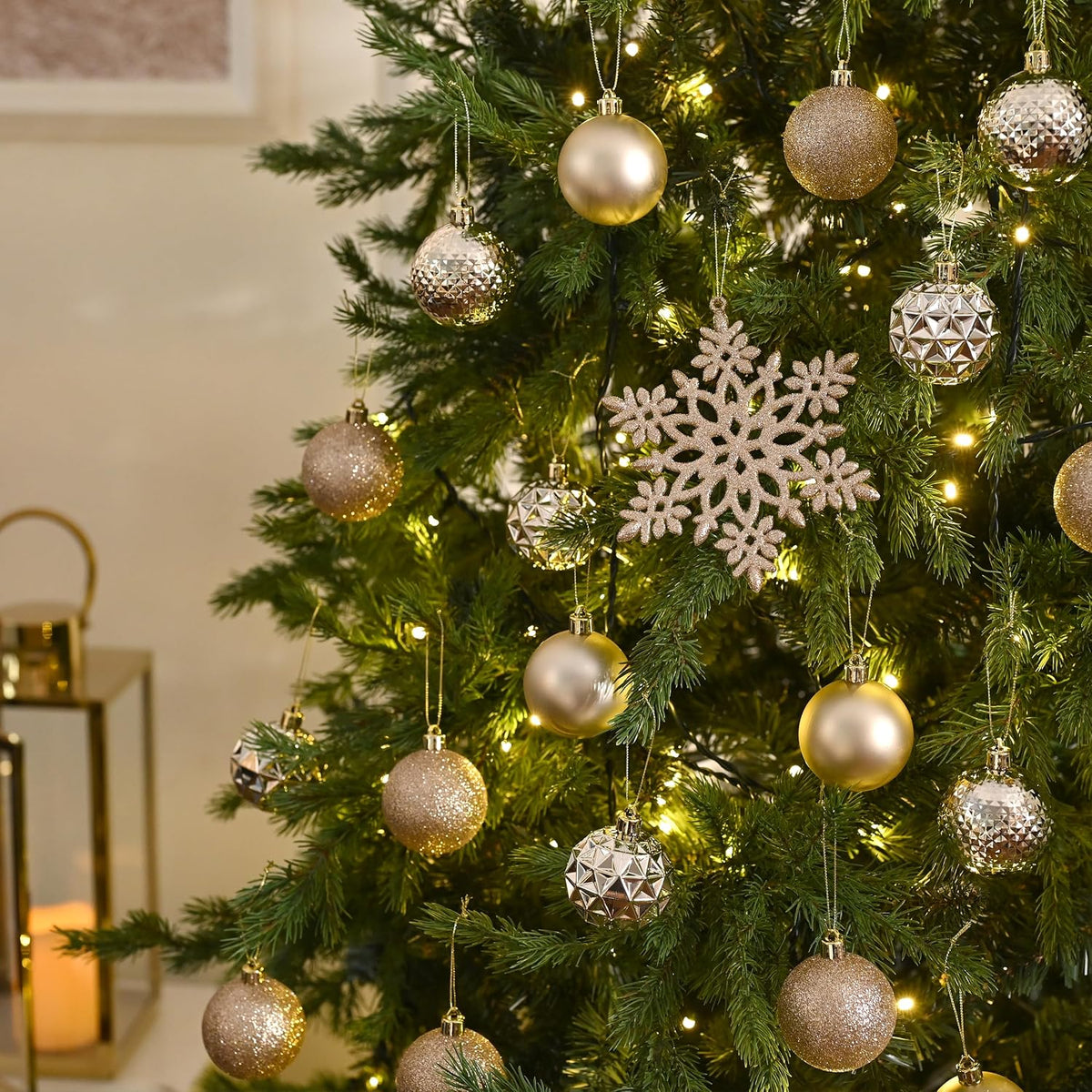 Christmas tree decorated with champagne balls and a snowflake