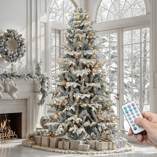 6.5 ft flocked Christmas tree lit in a living room, with its remote control