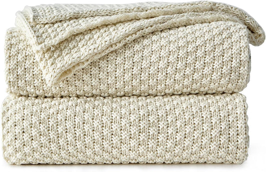 Cream cotton knit throw blanket, folded