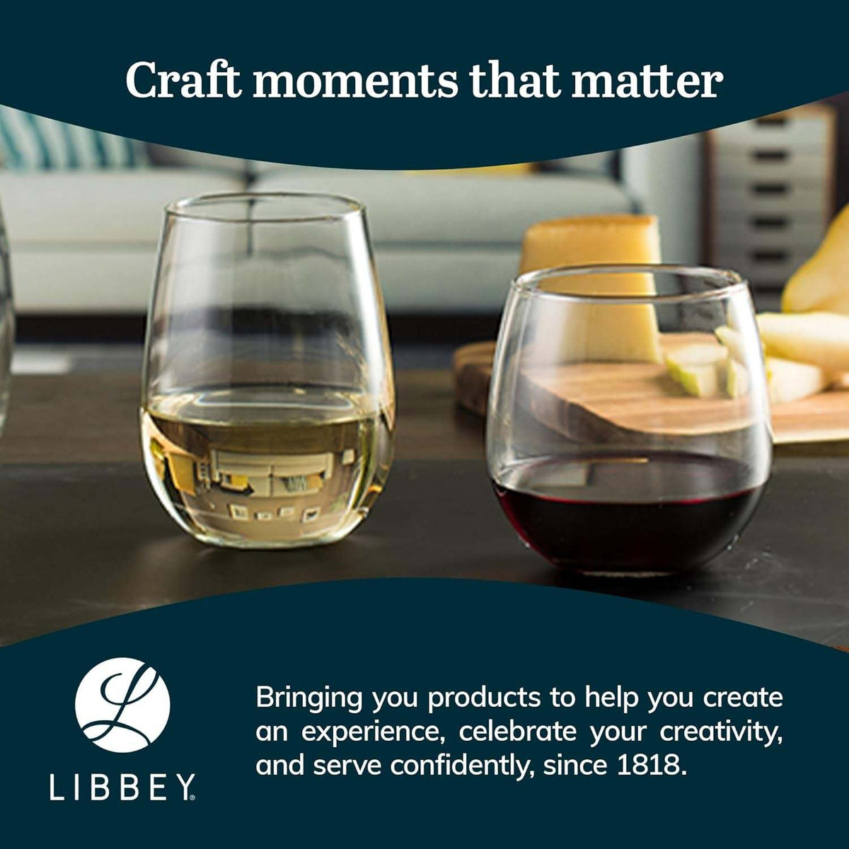 Stemless glasses with white and red wine beside a cheese board