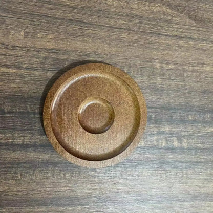 Close-up view of the weighted rotating base on the bottom of the whiskey tumbler
